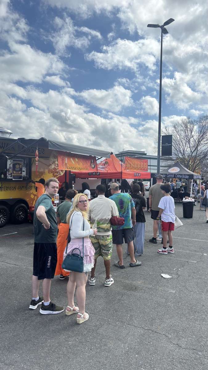 Festival crowd gathered around the Wok Lobster food truck